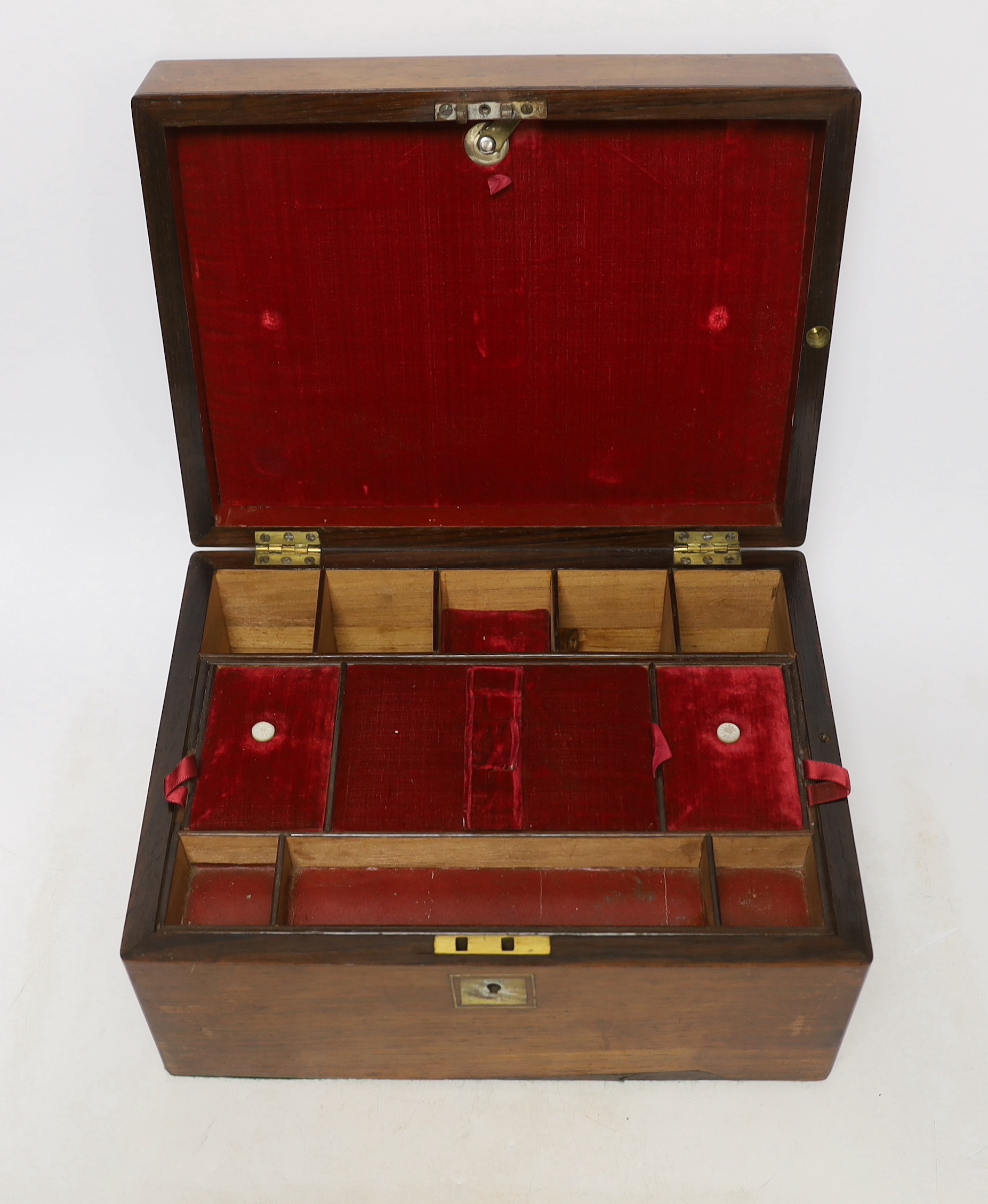 A Victorian rosewood sewing box with slide drawer